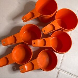 Tupperware vintage Orange Measuring Cups Set. From 1/4c to 1c.